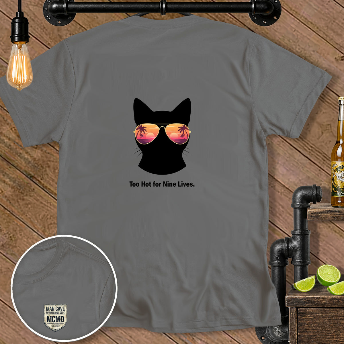 Gray t-shirt with black cat silhouette wearing sunglasses and text "Too Hot for Nine Lives."