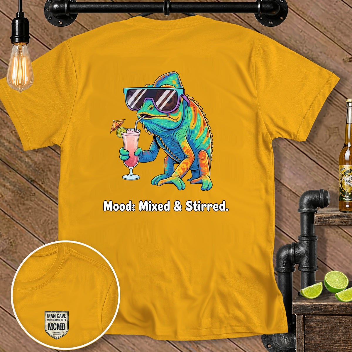 Yellow t-shirt with a chameleon holding a drink, text reads "Mood: Mixed & Stirred."
