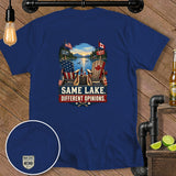 Blue t-shirt with US and Canadian flags, chairs, and text 