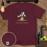 Maroon t-shirt with cartoon penguin bartender pouring whiskey and text 