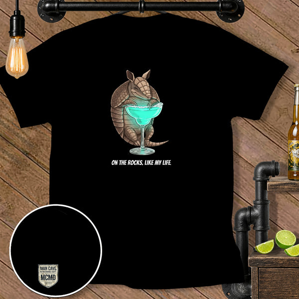 Armadillo holding a blue cocktail with text "On the rocks, like my life."