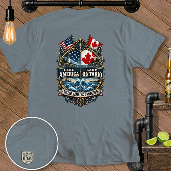Shirt graphic featuring Lake America Ontario, US and Canadian flags, and nautical elements.