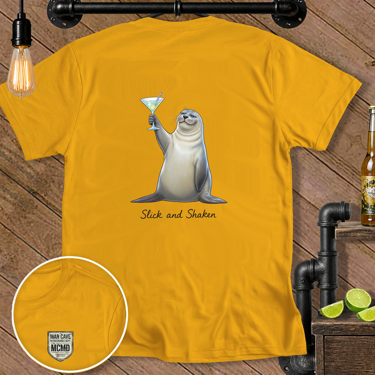 Yellow t-shirt with a seal holding a cocktail and the text "Slick and Shaken".