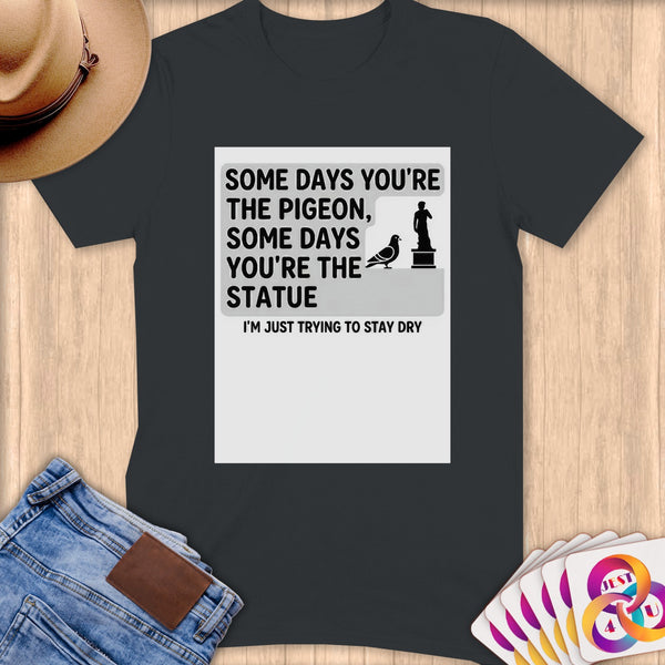 T-shirt with pigeon and statue graphic and text.