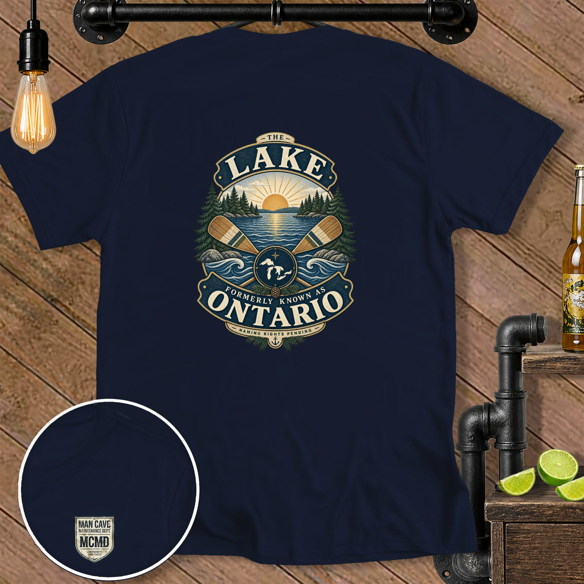 Navy t-shirt with "The Lake Formerly Known As Ontario" graphic and "Man Cave" patch.