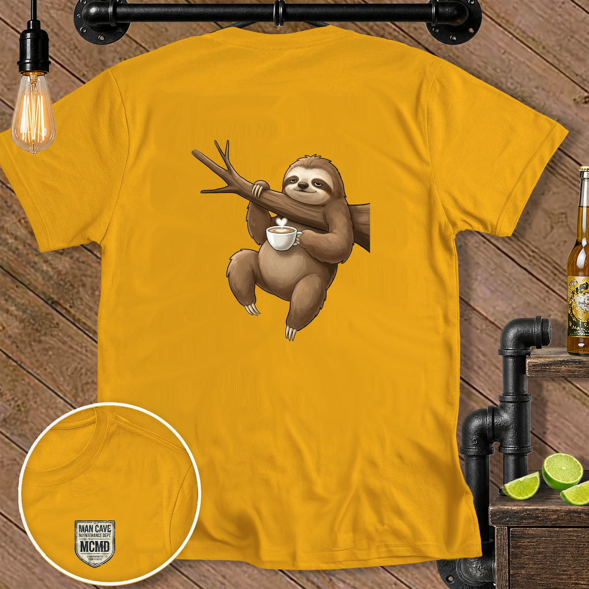 Yellow t-shirt with a cartoon sloth hanging on a branch holding a coffee cup.