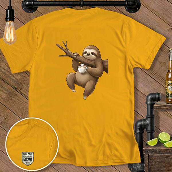 Yellow t-shirt with a cartoon sloth hanging on a branch holding a coffee cup.