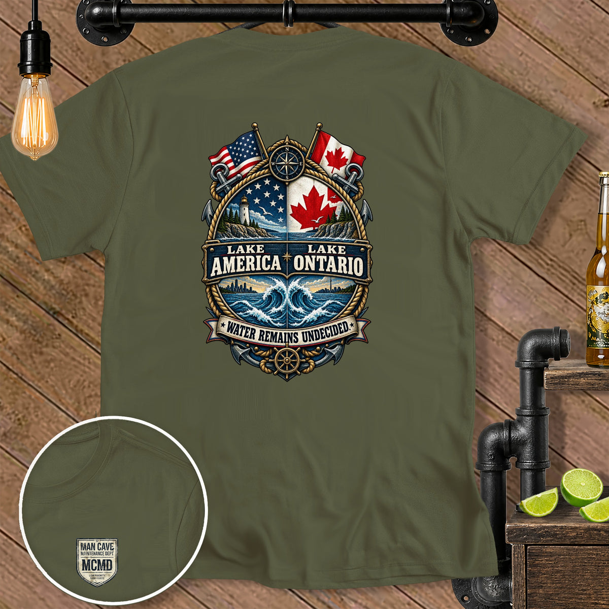 Olive t-shirt with Lake America Ontario graphic featuring US and Canadian flags, lighthouse, and waves.