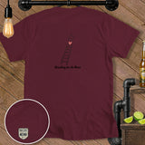 Burgundy t-shirt with ladder, heart, and star graphic and text 