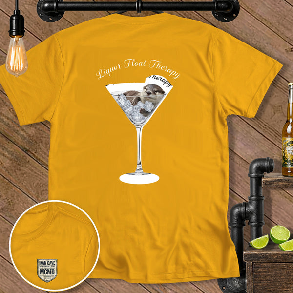 Yellow t-shirt with a martini glass holding an otter and ice, reads "Liquor Float Therapy".