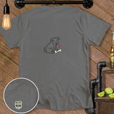 Grey t-shirt with a sketched dog holding a bone and a small heart.