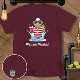 T-shirt with frog character holding a drink and wearing a hat and sunglasses. Text 