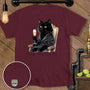 Black cat in a robe holding champagne, with text "Classy... 'Til the Cork Pops".